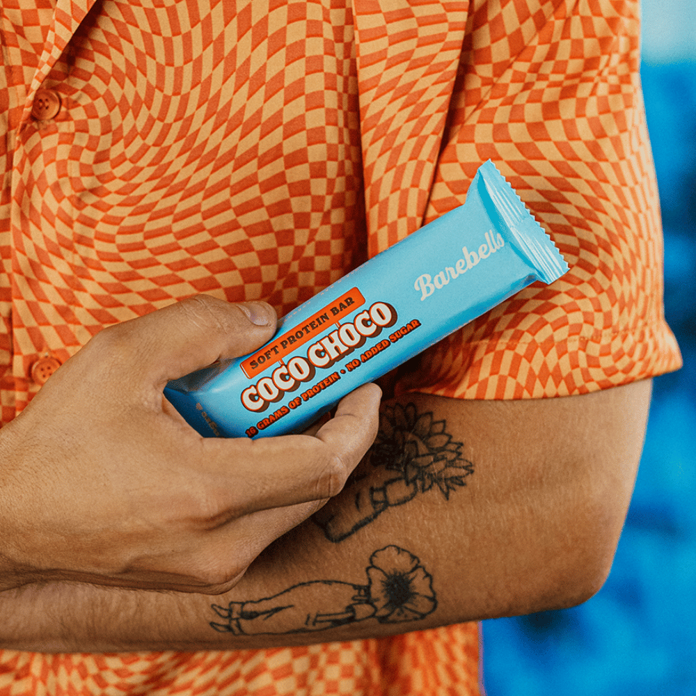 Barebells Coconut Chocolate Soft Protein Bar in hand