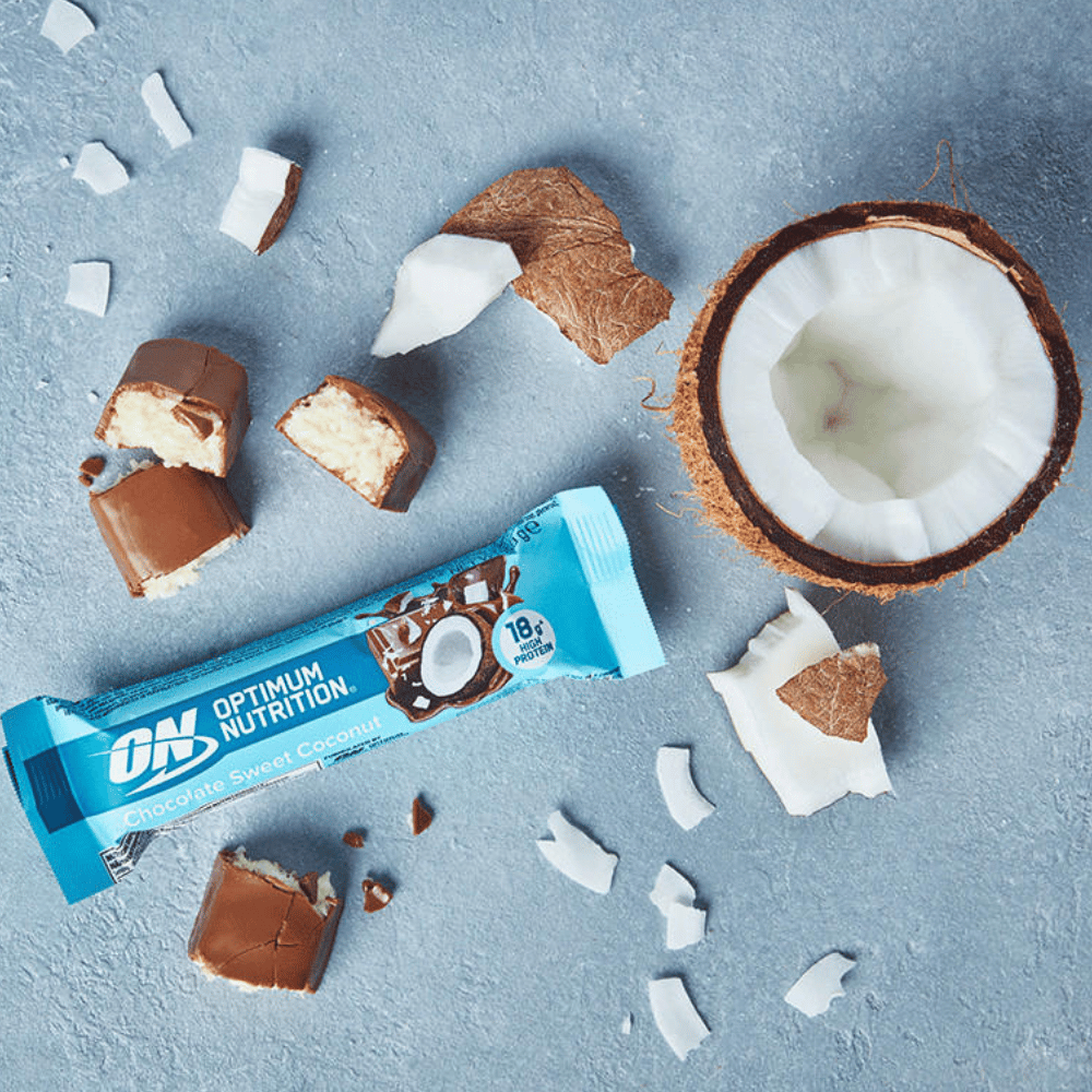 Inside the Optimum Coconut Chocolate Protein Bars with an opened coconut